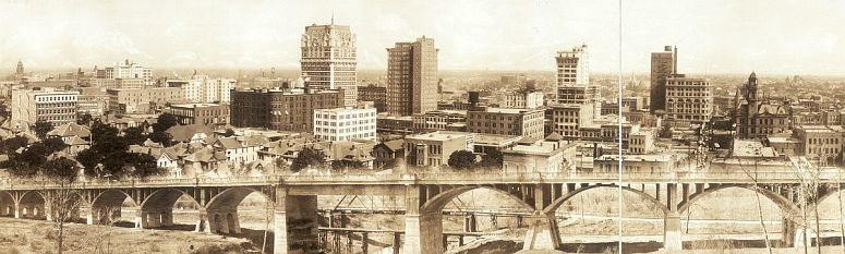 The Dallas skyline behind the Oak Cliff viaduct in 1912... click to see Dallas photos at the Library of Congress