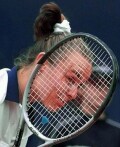 Martina looks through her racket during her match against Gala Leon Garcia 
